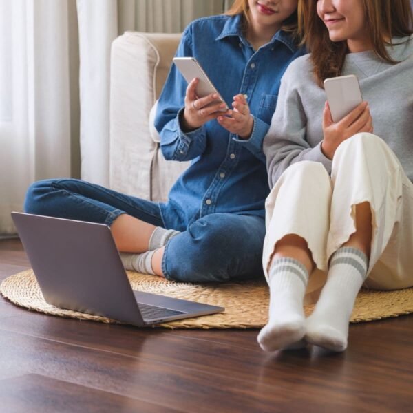 closeup-image-of-a-young-couple-women-using-mobile-2024-12-02-10-36-28-utc closeup-image-of-a-young-couple-women-using-mobile-2024-12-02-10-36-28-utc